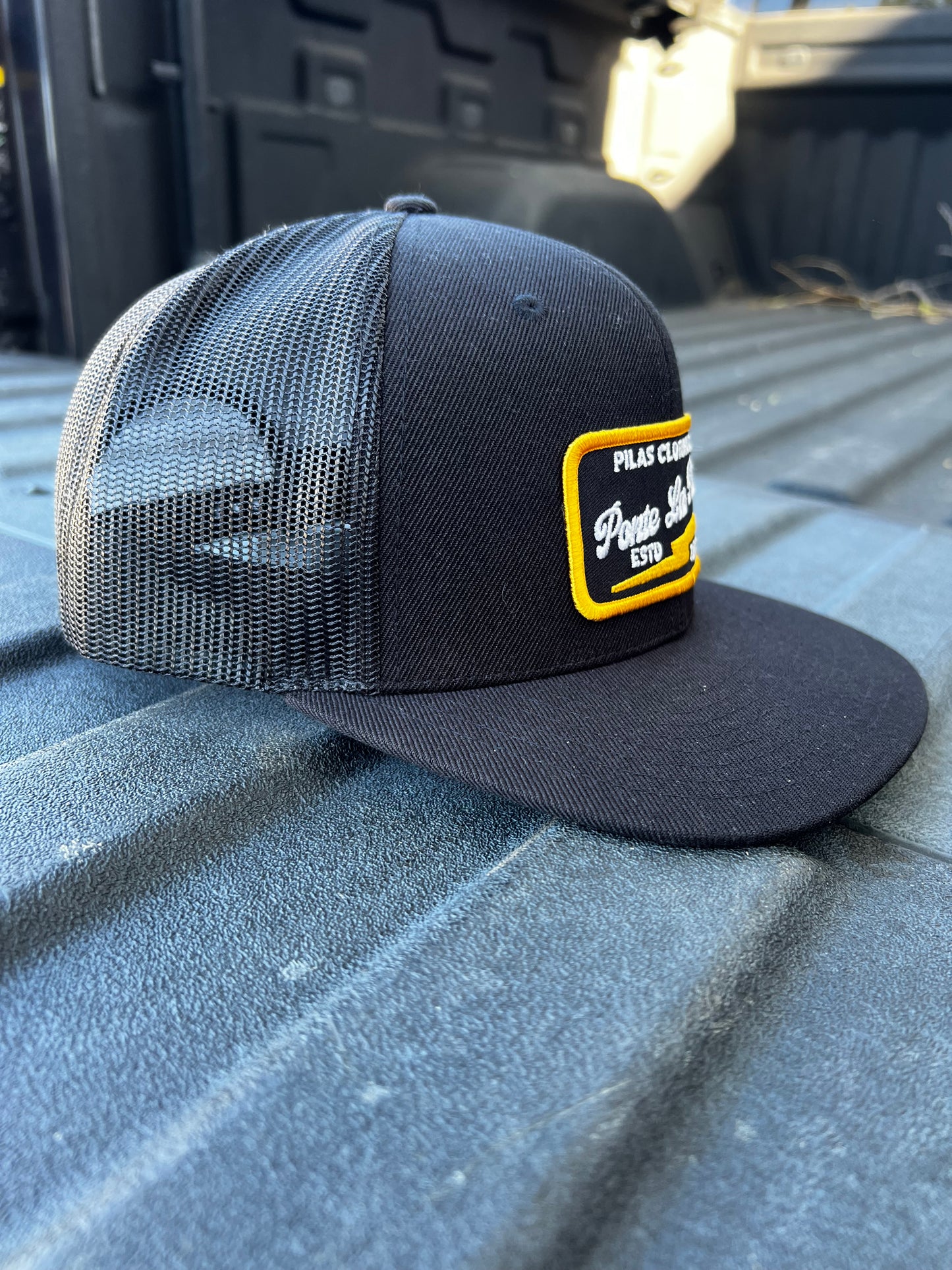 Pilas Clothing Co Ponte Las Pilas trucker hat - black mesh snapback cap for Latino workers