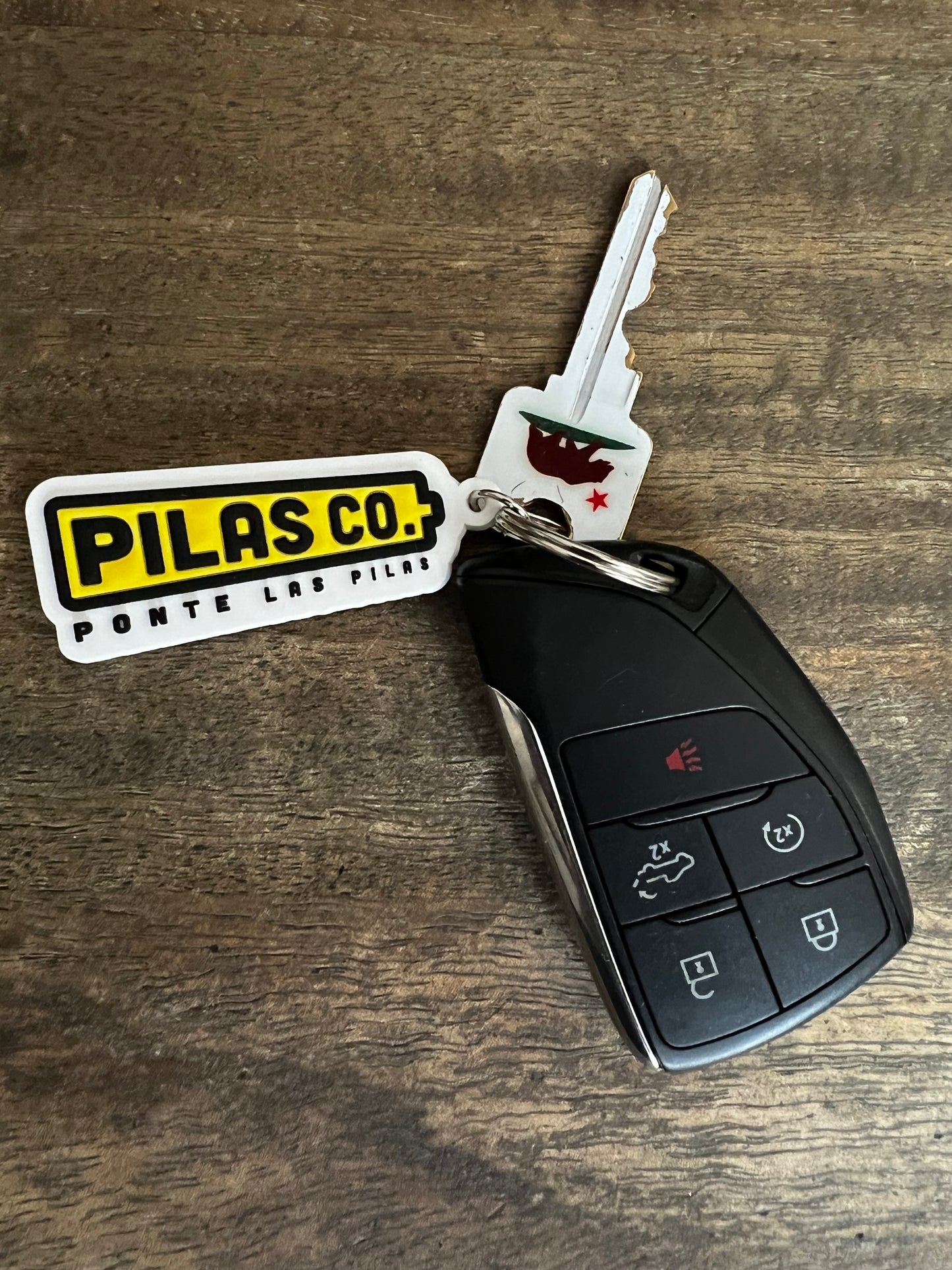 Pilas Co Ponte Las Pilas battery keychain - Latino workwear brand accessories