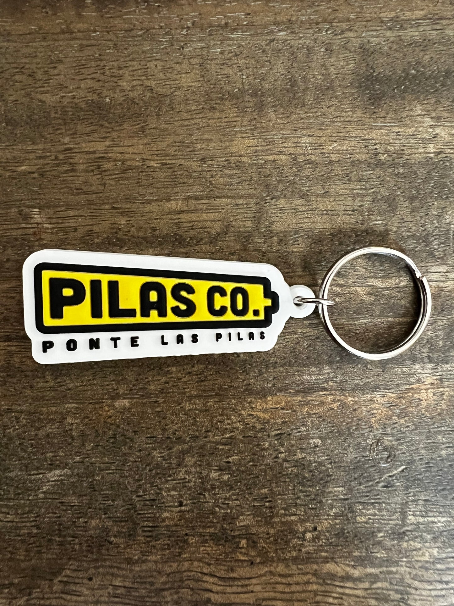 Pilas Co Ponte Las Pilas battery keychain - Latino workwear brand accessories