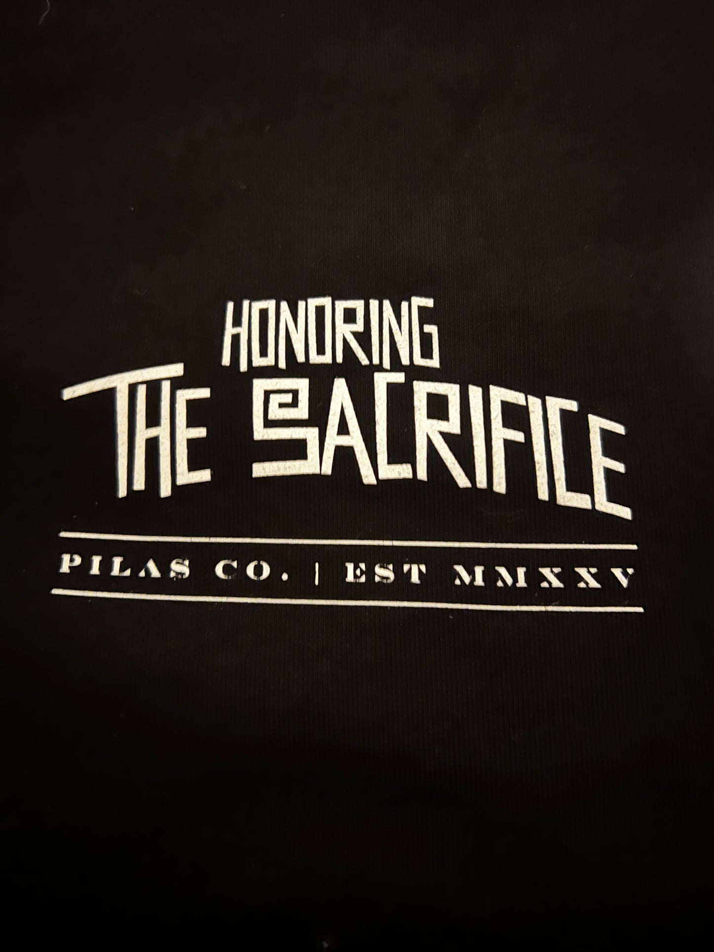Honoring the Sacrifice Mexican shirt for men front chest print - Pilas Co Est MMXXV logo on black heavyweight cotton tee