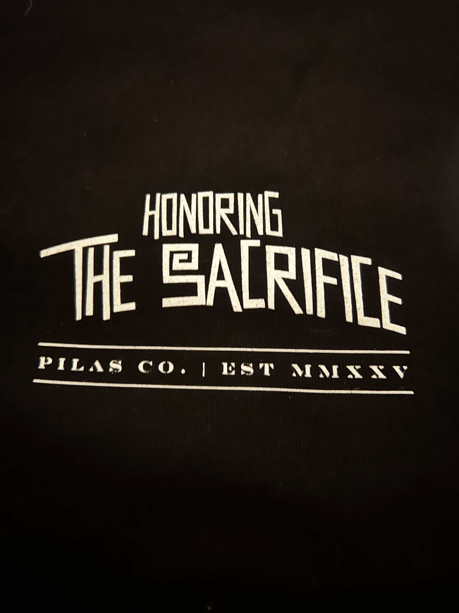 Honoring the Sacrifice Mexican shirt for men front chest print - Pilas Co Est MMXXV logo on black heavyweight cotton tee